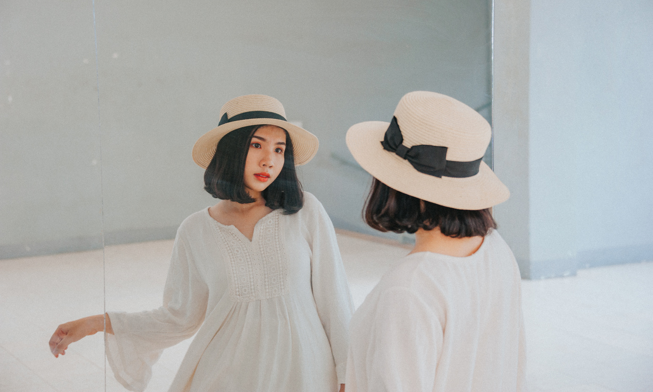 Woman Wearing White Long-sleeved Dress and Beige Sun Hat